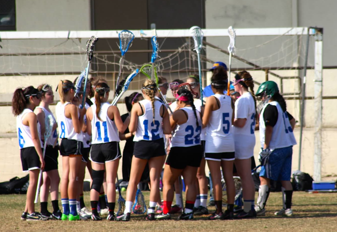 Harmon's Louisville club team huddles together.  