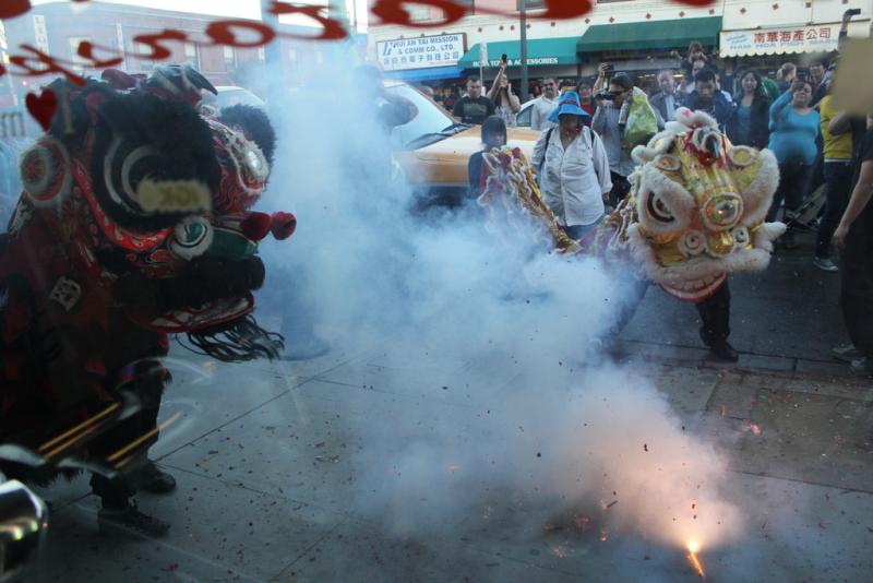 Chinatown celebrates The Year of the Dragon with lion dance and firecrackers in 2012. (Photo by Gracie Zheng/Neon Tommy)