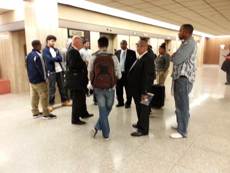 Spencer's father stands with others in the court building after the verdict is read. (Neon Tommy/Olga Grigoryants)