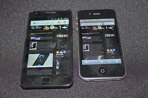 The older Samsung Galaxy SII next to Apple's iPhone 4. (gillyberlin/flickr). 