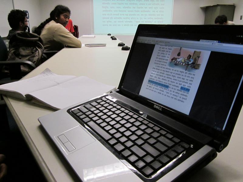 Kunal Mooley highlighted the sentence that he has to read at a Sanskrit class held in California Institute of Technology's library, while his fellow students listen on. (Megan Sweas)