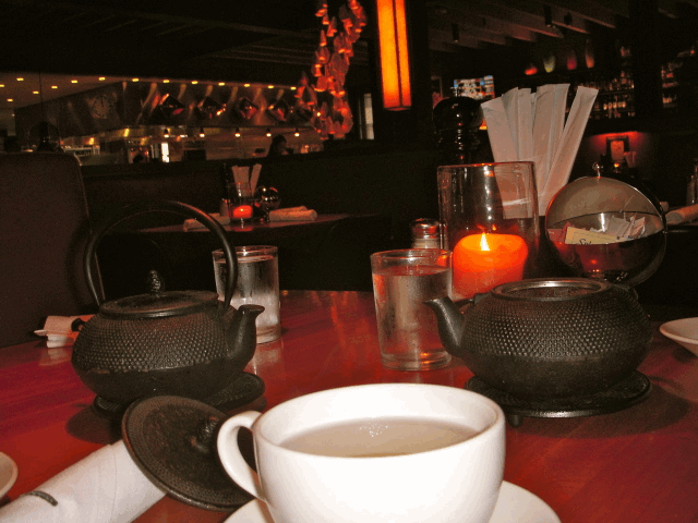 Teapots and a candle sit on top of one of the grill's tables. (Katherine Harwood/ Neon Tommy) Teapots and a candle sit on top of one of the grill's tables. (Katherine Harwood/ Neon Tommy)