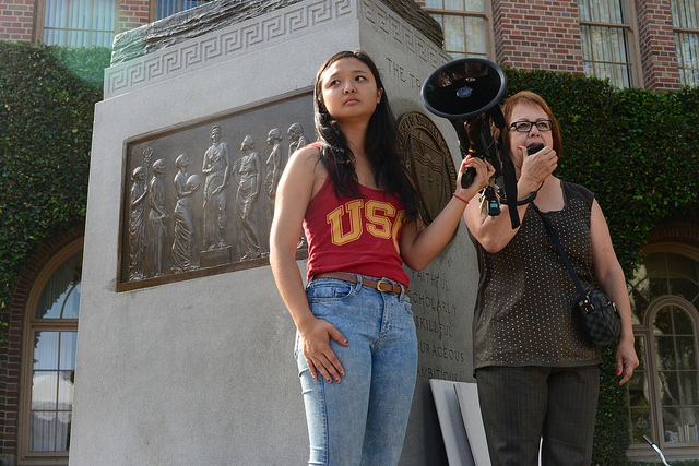 (Durazo and USC student protester on Tommy Trojan/Dale Chong, Neon Tommy)