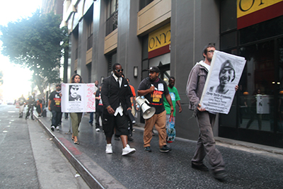 Protesters march along the streets of downtown Los Angeles to protest police brutality on Oct. 22, 2015. (Whitney Ashton/Annenberg Media)