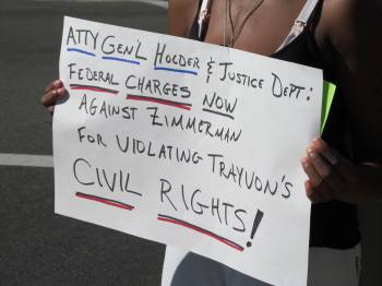 One of the signs held for drivers on La Cienega Blvd. to see. (Max Schwartz/Neon Tommy)