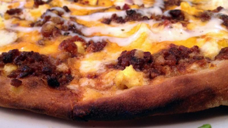 Wolfgang Puck Express' "Smoked Bacon Pizza" features a medley of savory flavors (Kelli Shiroma / Neon Tommy). Wolfgang Puck Express' "Smoked Bacon Pizza" features a medley of savory flavors (Kelli Shiroma / Neon Tommy).