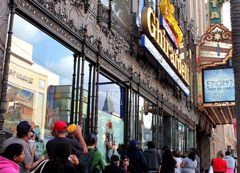 Customers wait in line the for the grand opening of the Ghirardelli Soda Fountain and Chocolate Shop and Disney Studio Store. (Daniella Segura / Neon Tommy)