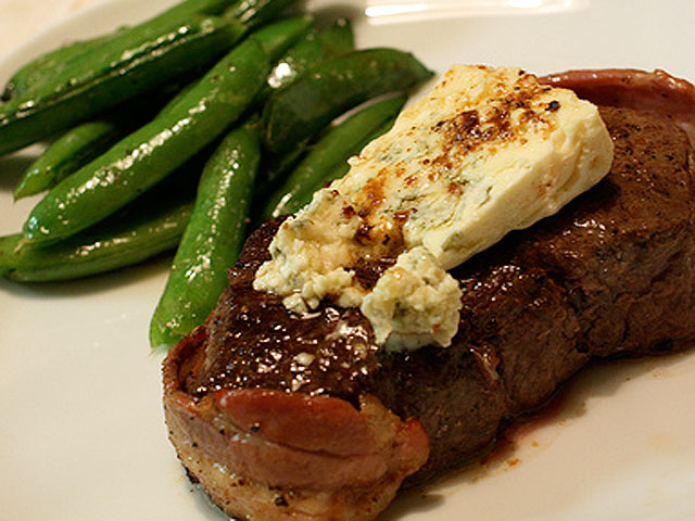 Filet mignon with a great assortment of sides provides a classy dinner for two (naotakem / Flickr).