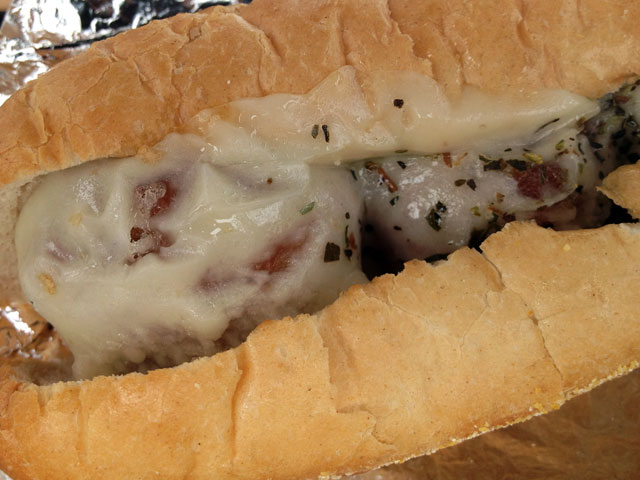 The “Balls ‘O Bacon” hot sandwich consists of applewood smoked bacon and pork shoulder meatballs, melted Provolone and chunky marinara (not pictured) on a nine-inch Amoroso’s Roll (Kelli Shiroma / Neon Tommy). The “Balls ‘O Bacon” hot sandwich consists of applewood smoked bacon and pork shoulder meatballs, melted Provolone and chunky marinara (not pictured) on a nine-inch Amoroso’s Roll (Kelli Shiroma / Neon Tommy).