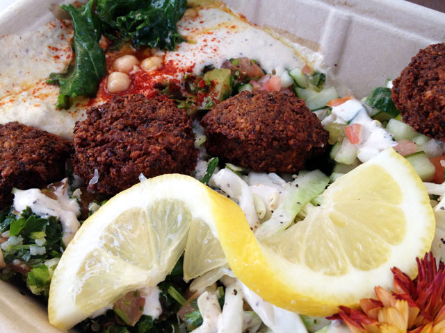 This “Fala Plate” (featuring “Original” falafel) includes four falafel balls, hummus, tahini, two salads and seasonal garnish (Kelli Shiroma / Neon Tommy).