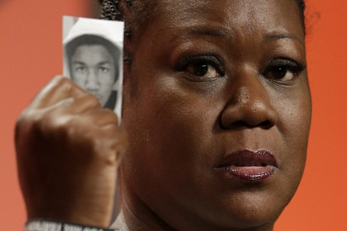 Sybrina Fulton holds up a picture in remembrance of her son via Flickr/Creative Commons Sybrina Fulton holds up a picture in remembrance of her son via Flickr/Creative Commons