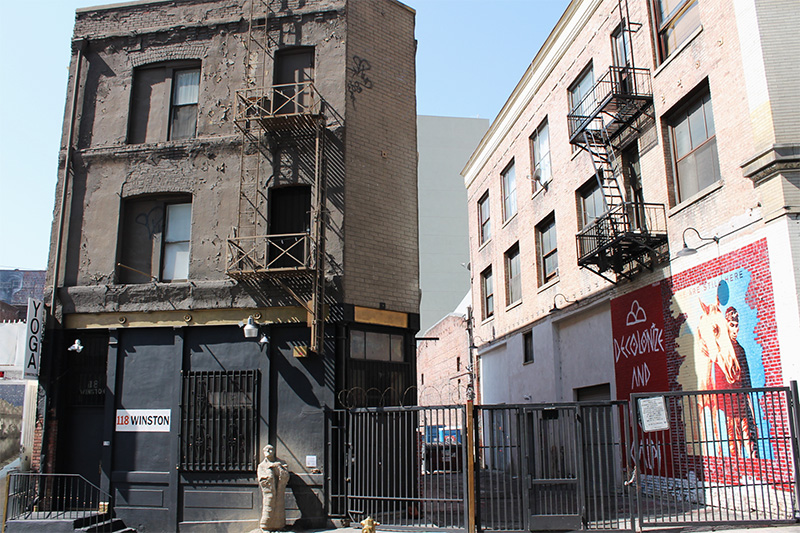 Indian Alley, located next to 118 Winston, with pieces by Shepard Fairey, Jaque Fragua and Wild Life visible on the west wall (Chrystal Li/Neon Tommy) 