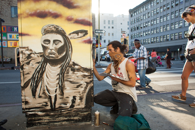 Street artist Bandit working on a utility box mural in Skid Row on January 19, 2014. (Photo courtesy Stephen Zeigler)