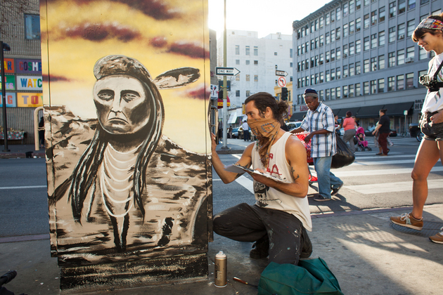 Street artist Bandit working on a utility box mural in Skid Row on January 19, 2014. (Photo courtesy Stephen Zeigler) Street artist Bandit working on a utility box mural in Skid Row on January 19, 2014. (Photo courtesy Stephen Zeigler)