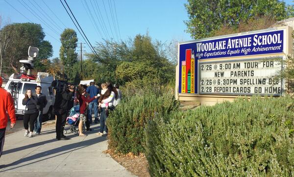 Dozens of parents gathered outside Woodlake Elementary Community Charter Wednesday morning (Chrystal Li/Neon Tommy)