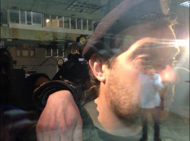 View of militia from inside barricaded coffee shop where UN specialist is trapped. (via James Mates/Twitter) View of militia from inside barricaded coffee shop where UN specialist is trapped. (via James Mates/Twitter)