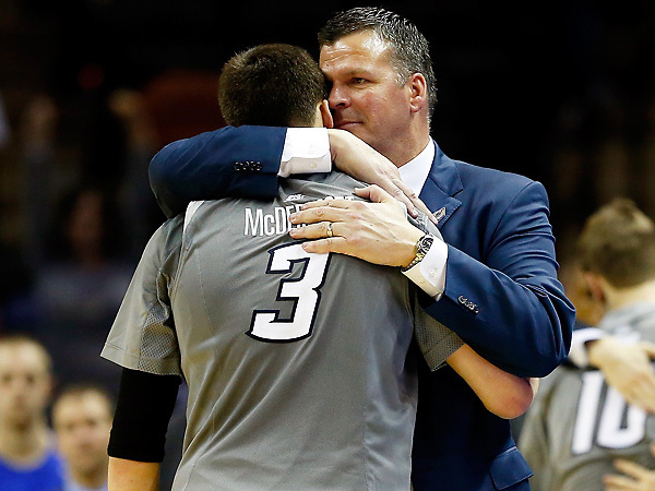 Coach Greg McDermott hugs his son, Doug, in the closing minutes of Creighton's 85-55 loss to Baylor. (Tom Pennington/Getty Images)
