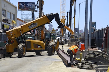 Newly hired construction workers trudge on even in the summer heat (Sara Newman/Neon Tommy)