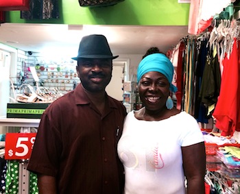 Beatrice and Emmanuel Eyo stand in her now-deserted clothing store (Sara Newman/Neon Tommy)