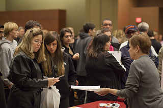 High school students and their parents attend a college fair last fall. (Creative Commons/ COD Newsroom) High school students and their parents attend a college fair last fall. (Creative Commons/ COD Newsroom)