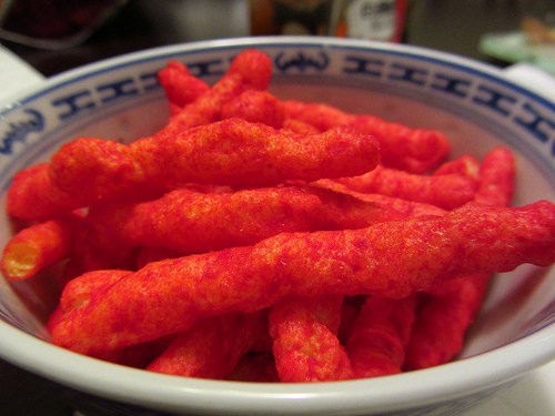 Flamin' Hot Cheetos have been banned at several schools because of its lack of nutrients (Calgary Reviews / Creative Commons) Flamin' Hot Cheetos have been banned at several schools because of its lack of nutrients (Calgary Reviews / Creative Commons)