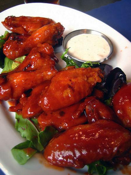 Buffalo wings, boneless or not, are a staple at any football gathering (rick / Flickr). Buffalo wings, boneless or not, are a staple at any football gathering (rick / Flickr).